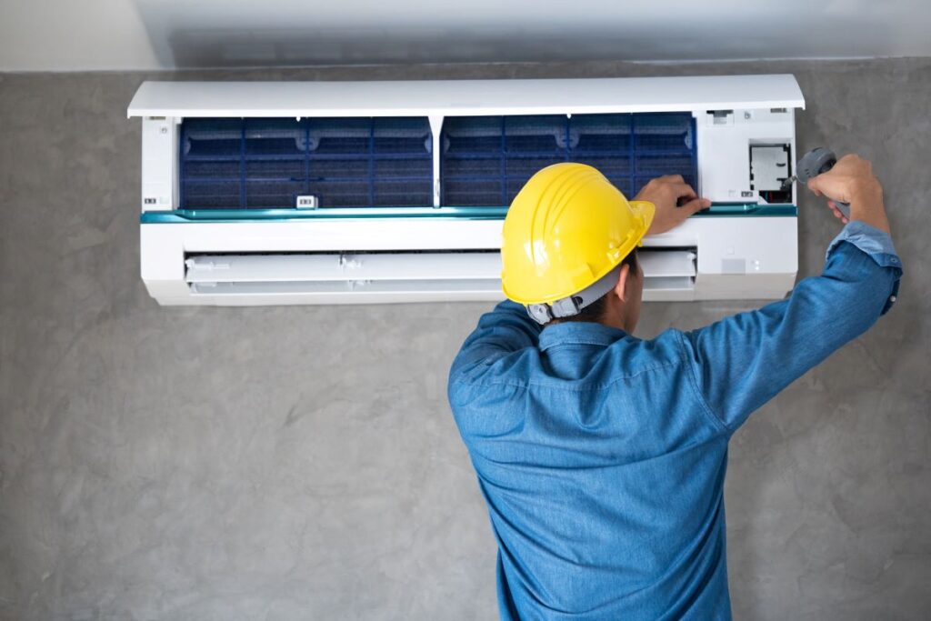 hvac tech working on ac